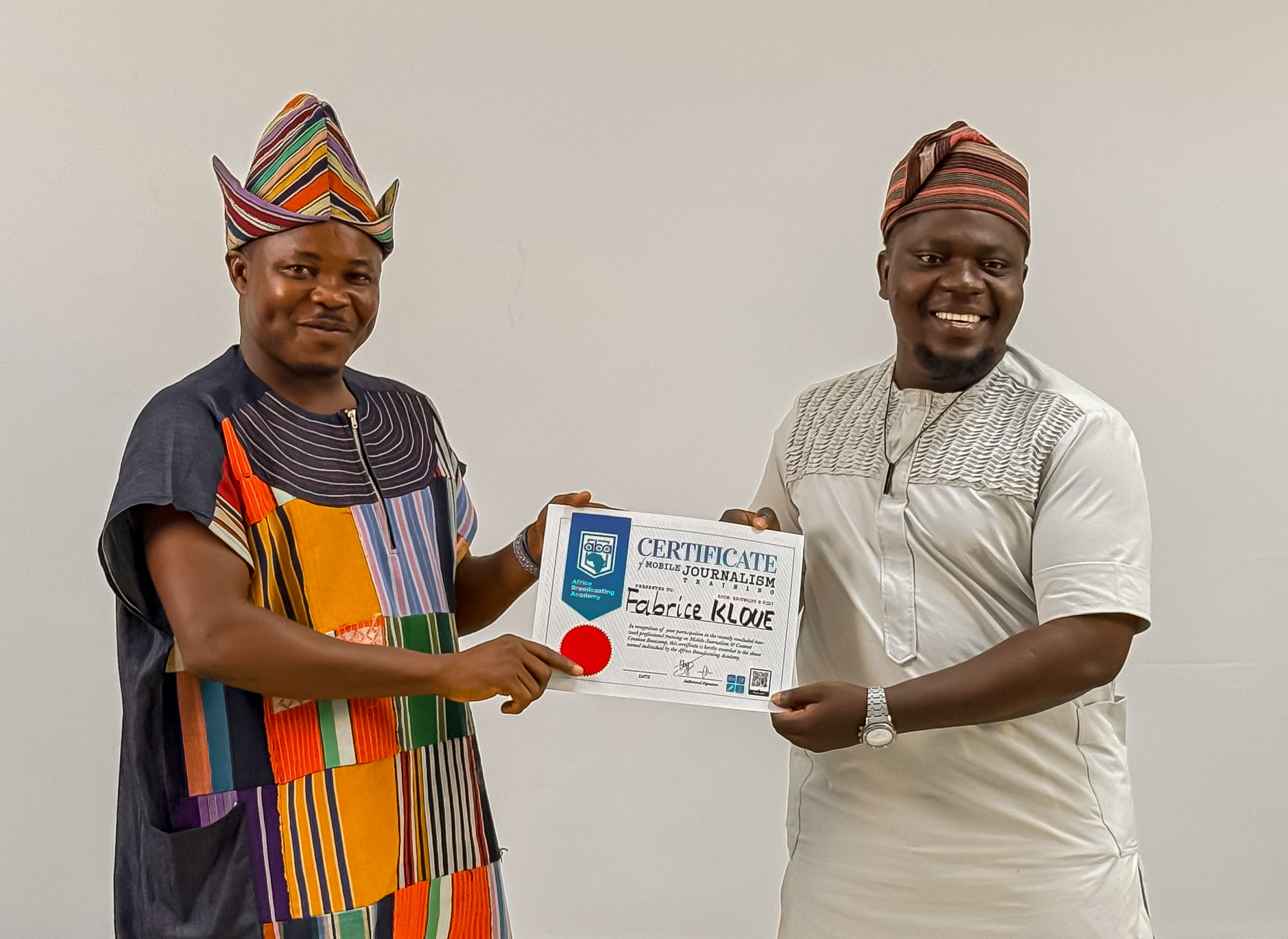 African storyteller filming a documentary in a rural setting